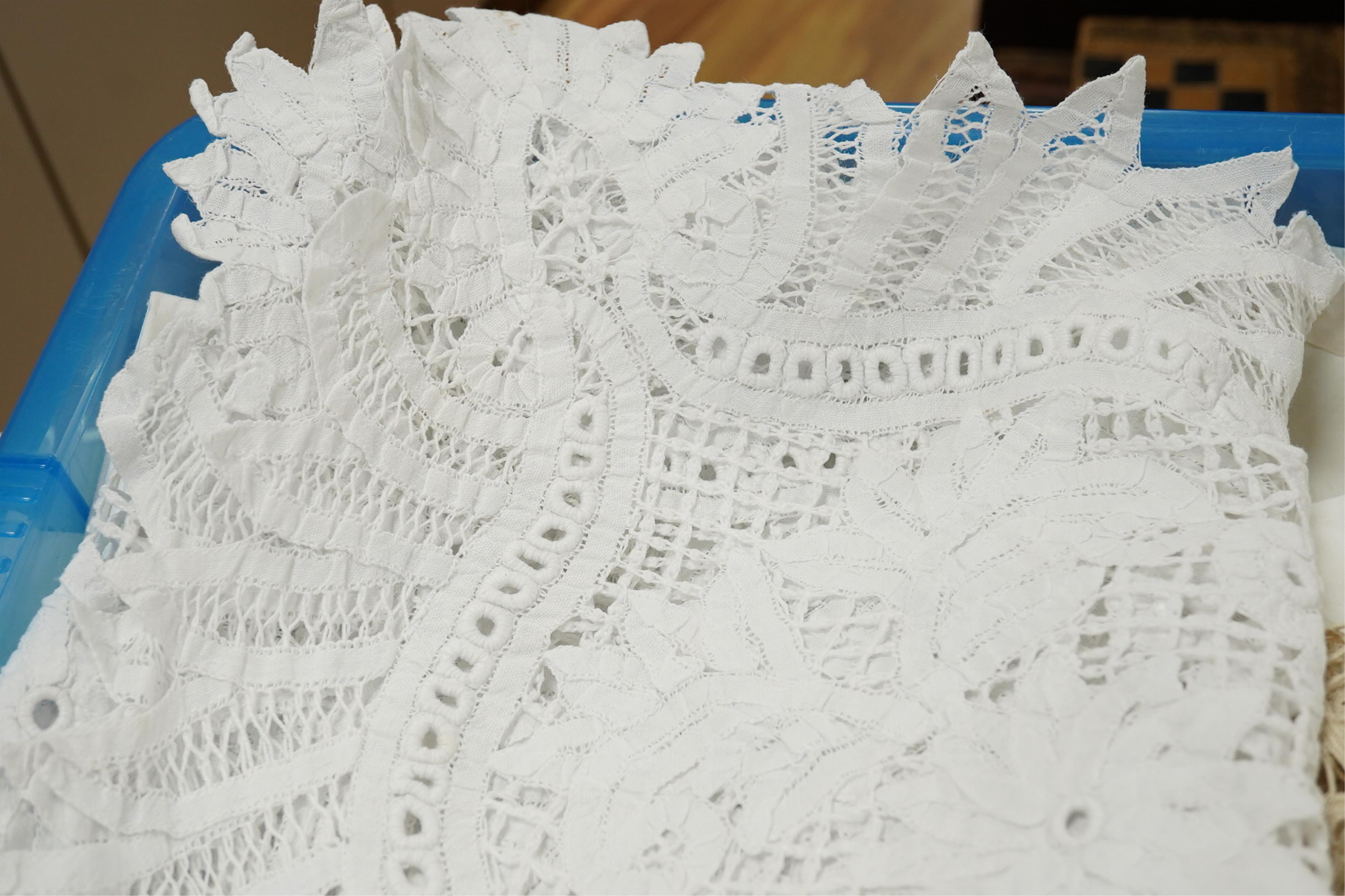 A collection of early 20th century and later crochet, cut work and drawn thread table linens and a large embroidered table cloth
